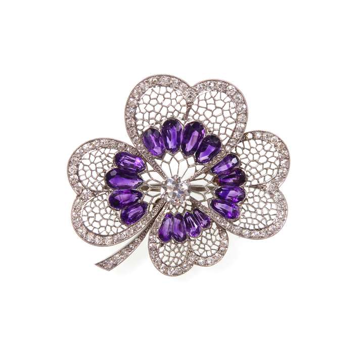 Amethyst and diamond four leaf clover brooch, with pierced openwork detail